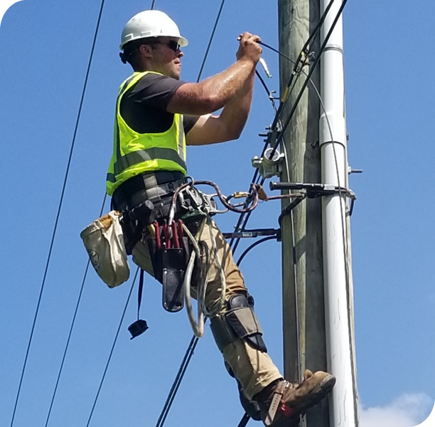 Construction installing fiber on pole Construction installing fiber on pole