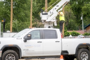 Fiber internet technician servicing residential broadband equipment, representing flexible no-contract internet options.