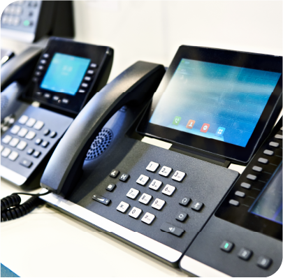 Managed Voice phones in a line on a desk