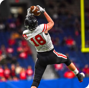 Football player jumping to make a catch.