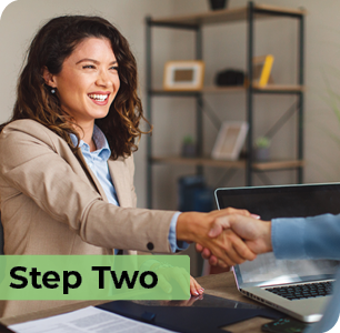Businesswoman smiling shaking hands with someone. Step Two. Businesswoman smiling shaking hands with someone. Step Two.