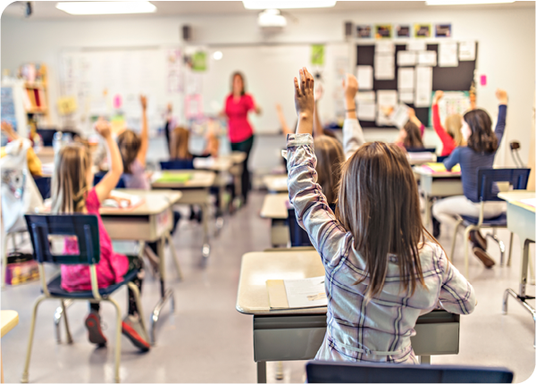 children in classroom raising hand children in classroom raising hand